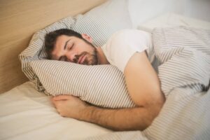 man sleeping with pilow