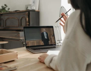 woman attending virtual webinar